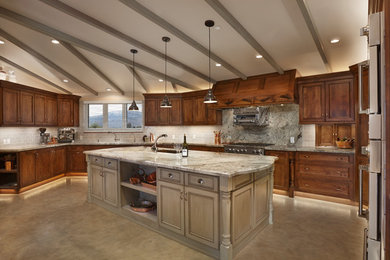 Huge transitional u-shaped concrete floor kitchen pantry photo in Phoenix with an undermount sink, recessed-panel cabinets, distressed cabinets, granite countertops, green backsplash, ceramic backsplash, colored appliances and an island