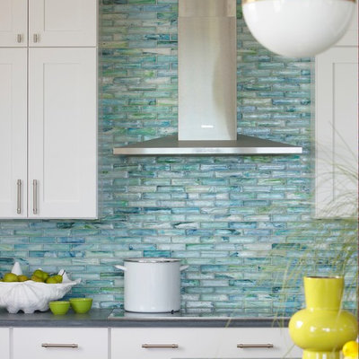 Eat-in kitchen - coastal eat-in kitchen idea in Boston with shaker cabinets, white cabinets, glass tile backsplash, granite countertops, blue backsplash, stainless steel appliances and an island
