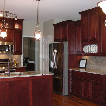 Rich colored cherry cabinets with glass accents