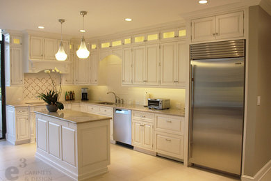 Eat-in kitchen - traditional l-shaped eat-in kitchen idea in Charlotte with an undermount sink, raised-panel cabinets, white cabinets, quartz countertops, white backsplash, subway tile backsplash and stainless steel appliances