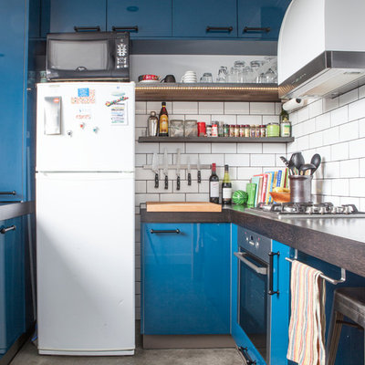 Inspiration for a contemporary enclosed kitchen remodel in Melbourne with open cabinets, white appliances, wood countertops, white backsplash, subway tile backsplash and blue cabinets