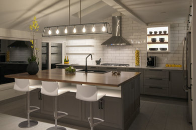 Kitchen photo in Ottawa with a double-bowl sink and white backsplash