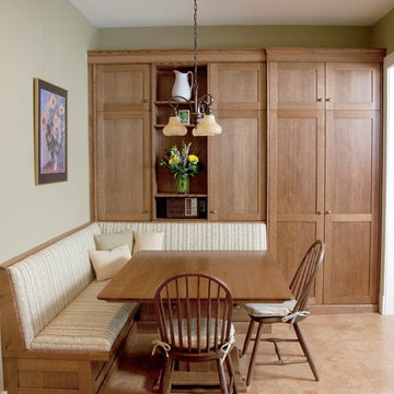 Rift-cut oak cabinetry with banquette