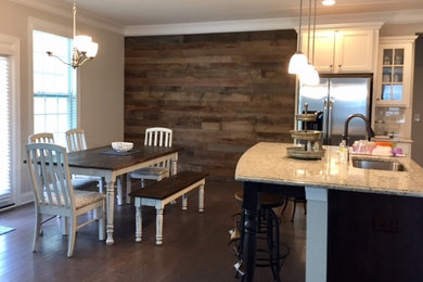 Inspiration for a mid-sized rustic l-shaped dark wood floor and brown floor eat-in kitchen remodel in Charlotte with an undermount sink, recessed-panel cabinets, white cabinets, granite countertops, white backsplash, subway tile backsplash, stainless steel appliances and an island