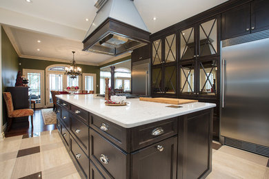 Eat-in kitchen - large transitional l-shaped porcelain tile eat-in kitchen idea in Toronto with an undermount sink, shaker cabinets, dark wood cabinets, quartz countertops, stainless steel appliances, an island, white backsplash and stone slab backsplash
