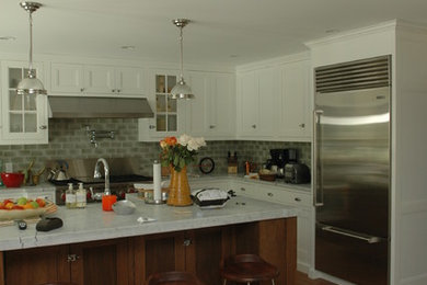 Inspiration for a modern kitchen remodel in Philadelphia with shaker cabinets, white cabinets and an island