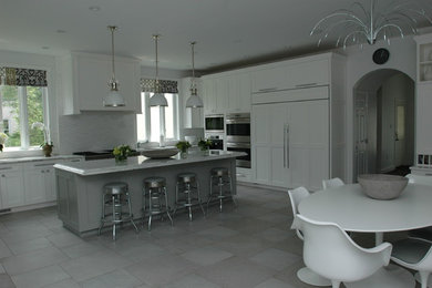 Kitchen - contemporary kitchen idea in Philadelphia with shaker cabinets, white cabinets and an island