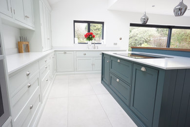 Medium sized contemporary l-shaped kitchen/diner in Kent with beaded cabinets and an island.