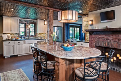 Large farmhouse l-shaped medium tone wood floor and brown floor eat-in kitchen photo in New York with a farmhouse sink, beaded inset cabinets, white cabinets, granite countertops, green backsplash, matchstick tile backsplash, stainless steel appliances and an island
