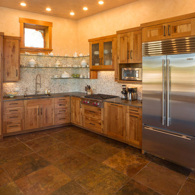 Kitchen - rustic l-shaped kitchen idea in Denver with an undermount sink, shaker cabinets, medium tone wood cabinets and stainless steel appliances