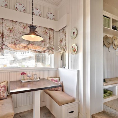 Inspiration for a shabby-chic style concrete floor eat-in kitchen remodel in Austin with white cabinets