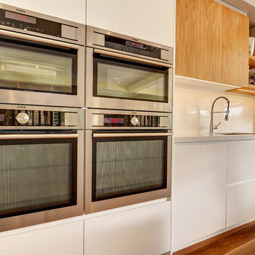 Contemporary Kitchen with chef ovens