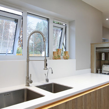 Rotpunkt Wood & High Gloss Kitchen in Bardolia & Zerox HL Icy White.