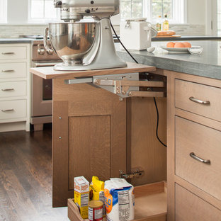 Design ideas for a large transitional l-shaped eat-in kitchen in New York with an integrated sink, shaker cabinets, grey cabinets, limestone benchtops, beige splashback, mosaic tile splashback, stainless steel appliances, dark hardwood floors and with island.