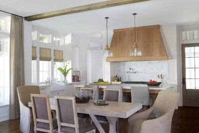 Open concept kitchen - large transitional l-shaped dark wood floor and brown floor open concept kitchen idea in Birmingham with a farmhouse sink, shaker cabinets, white cabinets, quartz countertops, white backsplash, marble backsplash, stainless steel appliances and an island