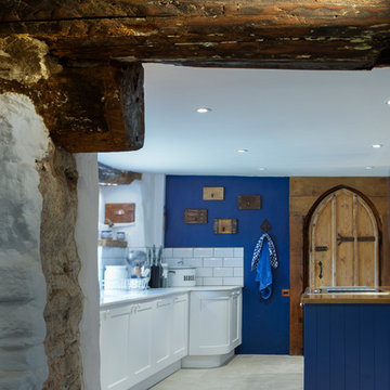 Royal Blue Gothic shaker style with Copper worktop in stone cottage kitchen