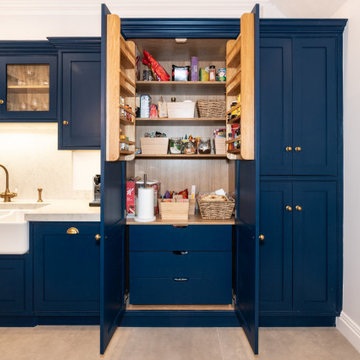 Royal Navy Blue Shaker Style Kitchen with integrated dining seating