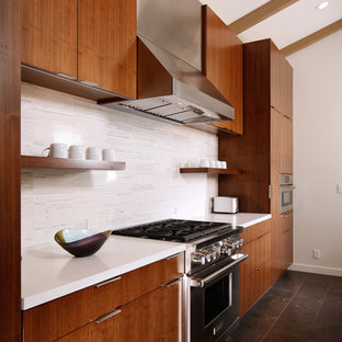 Expansive contemporary l-shaped eat-in kitchen in Los Angeles with an undermount sink, flat-panel cabinets, dark wood cabinets, quartz benchtops, white splashback, matchstick tile splashback, stainless steel appliances, marble floors, with island, blue floor and yellow benchtop.