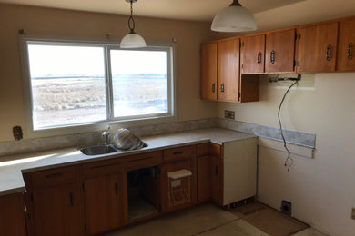 Mid-sized l-shaped kitchen photo in Calgary