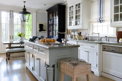 Classic kitchen/diner in Toronto with a submerged sink, recessed-panel cabinets, white cabinets, white splashback, metro tiled splashback and integrated appliances.