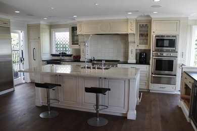 Mid-sized transitional galley eat-in kitchen photo in Los Angeles with beaded inset cabinets, beige cabinets and an island