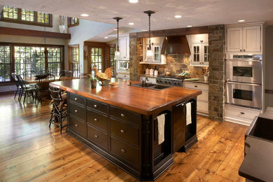 Inspiration for a timeless eat-in kitchen remodel in Milwaukee with black cabinets