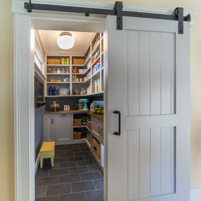 Example of a mid-sized cottage ceramic tile and gray floor kitchen pantry design in Boston with recessed-panel cabinets, gray cabinets and wood countertops