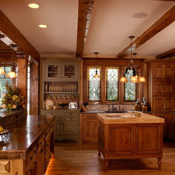 Rustic Cabinet Kitchen with Copper, Stone and Butchers Block Countertops