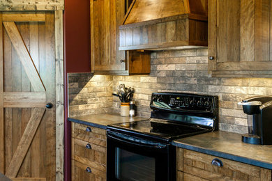 Inspiration for a mid-sized rustic eat-in kitchen remodel in Edmonton with a double-bowl sink, shaker cabinets, medium tone wood cabinets, laminate countertops, black appliances and an island