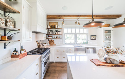 White Farmhouse Kitchen Warmed by Wood and Metal