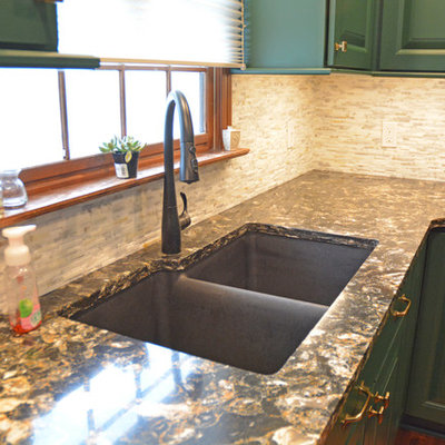 Example of a small transitional l-shaped medium tone wood floor and brown floor eat-in kitchen design in Other with an undermount sink, raised-panel cabinets, green cabinets, quartz countertops, white backsplash, marble backsplash, black appliances, an island and multicolored countertops