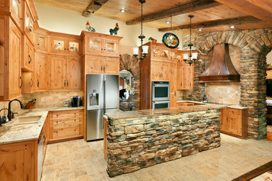 Example of a large mountain style u-shaped ceramic tile and beige floor eat-in kitchen design in Other with an undermount sink, recessed-panel cabinets, medium tone wood cabinets, granite countertops, beige backsplash, stone tile backsplash, stainless steel appliances and an island