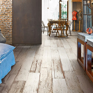 Example of a huge mountain style single-wall porcelain tile eat-in kitchen design in Los Angeles with open cabinets, medium tone wood cabinets, concrete countertops and stainless steel appliances
