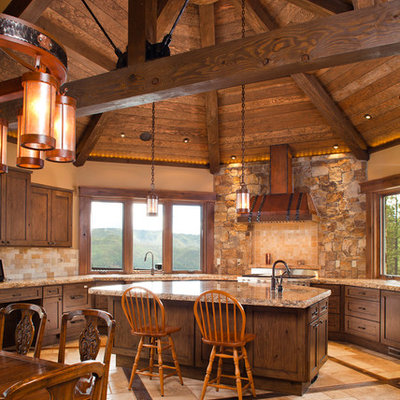 Inspiration for a huge rustic u-shaped travertine floor and beige floor open concept kitchen remodel in Denver with an undermount sink, shaker cabinets, dark wood cabinets, granite countertops, multicolored backsplash, stone tile backsplash, stainless steel appliances and an island