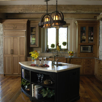 Rustic Kitchen with Reclaimed Knotty Heart Pine Floors and WoodMode Cabinetry