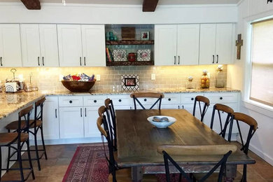 Inspiration for a mid-sized rustic eat-in kitchen remodel in Columbus with shaker cabinets, white cabinets, granite countertops, gray backsplash, porcelain backsplash, a peninsula and multicolored countertops