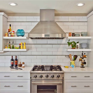 Trendy kitchen photo in San Diego with subway tile backsplash, white cabinets, white backsplash and stainless steel appliances