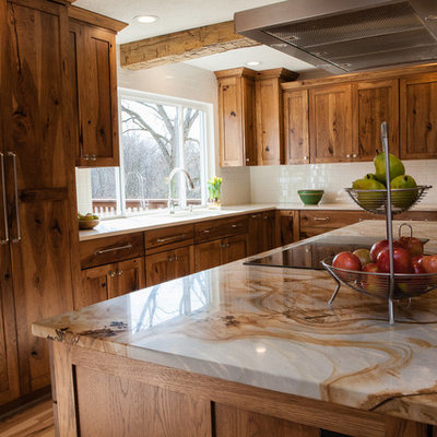 Mid-sized mountain style l-shaped light wood floor eat-in kitchen photo in Indianapolis with medium tone wood cabinets, quartzite countertops, white backsplash, subway tile backsplash, paneled appliances, an island, an undermount sink, shaker cabinets and multicolored countertops
