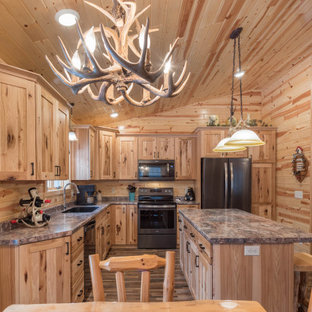 Design ideas for a mid-sized country l-shaped eat-in kitchen in Minneapolis with an undermount sink, shaker cabinets, medium wood cabinets, laminate benchtops, stainless steel appliances, linoleum floors, with island, multi-coloured floor and turquoise benchtop.