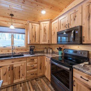 Photo of a mid-sized country l-shaped eat-in kitchen in Minneapolis with an undermount sink, shaker cabinets, medium wood cabinets, laminate benchtops, stainless steel appliances, linoleum floors, with island, multi-coloured floor and turquoise benchtop.