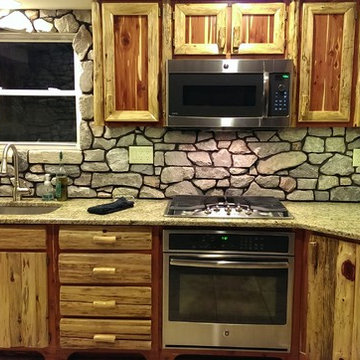 Rustic Red Cedar Kitchen with cultured Stone Backsplash