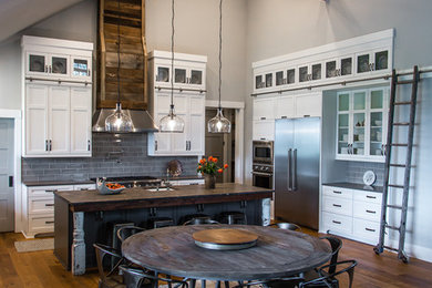 Inspiration for a large rustic u-shaped kitchen in Portland with an island.