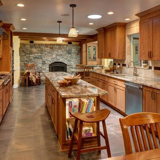 Large southwestern open concept kitchen ideas - Inspiration for a large southwestern galley porcelain tile and gray floor open concept kitchen remodel in Salt Lake City with an undermount sink, shaker cabinets, light wood cabinets, granite countertops, beige backsplash, porcelain backsplash, stainless steel appliances and an island