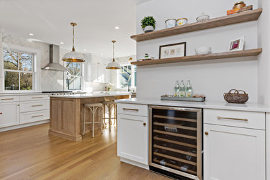 Mid-sized cottage u-shaped kitchen photo in New York with shaker cabinets, light wood cabinets and an island