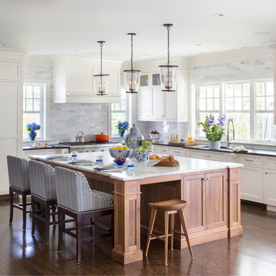 Open concept kitchen - large transitional l-shaped medium tone wood floor open concept kitchen idea in New York with an undermount sink, shaker cabinets, white cabinets, marble countertops, gray backsplash, an island, stainless steel appliances and marble backsplash