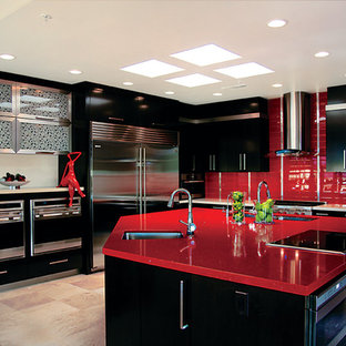 Inspiration for a contemporary kitchen in Phoenix with stainless steel appliances, an undermount sink, flat-panel cabinets, black cabinets, quartz benchtops, red splashback and red benchtop.