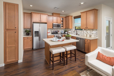 Example of a mid-sized transitional l-shaped open concept kitchen design in Sacramento with light wood cabinets, multicolored backsplash, stainless steel appliances and an island