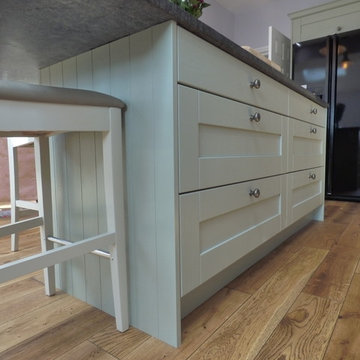 sage green painted shaker in large open plan kitchen