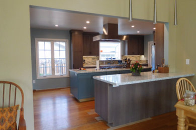 Large elegant u-shaped light wood floor and brown floor open concept kitchen photo in San Francisco with an undermount sink, flat-panel cabinets, medium tone wood cabinets, quartz countertops, multicolored backsplash, porcelain backsplash, stainless steel appliances, an island and gray countertops