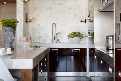 Photo of a contemporary kitchen in San Francisco with flat-panel cabinets, white splashback and dark hardwood flooring.